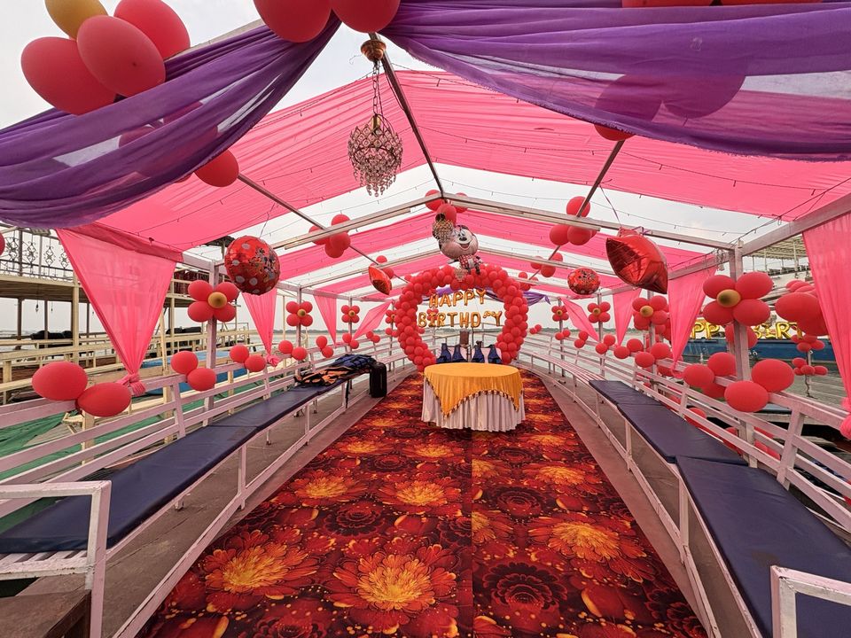 Birthday event on boat in Varanasi with pink canopy decoration – Varanasi Boat Events